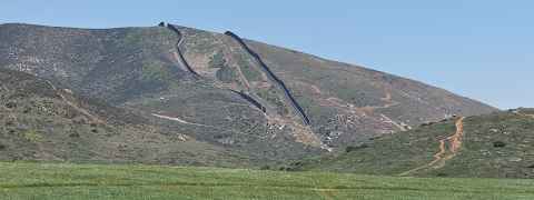 Photo of international border wall.